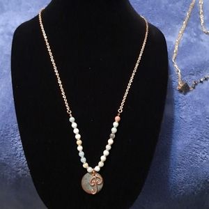 Gold necklace with P initial
